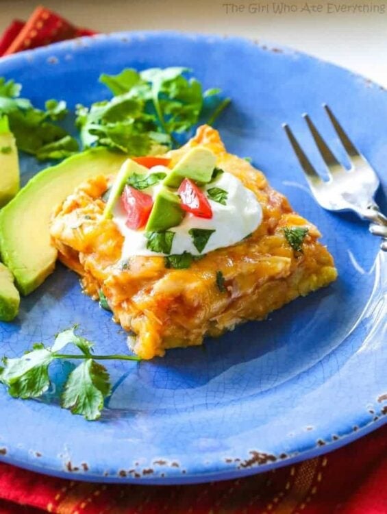 Chicken Tamale Casserole - a sweet cornbread crust topped with enchilada sauce and chicken. This is a crowd pleaser! the-girl-who-ate-everything.com