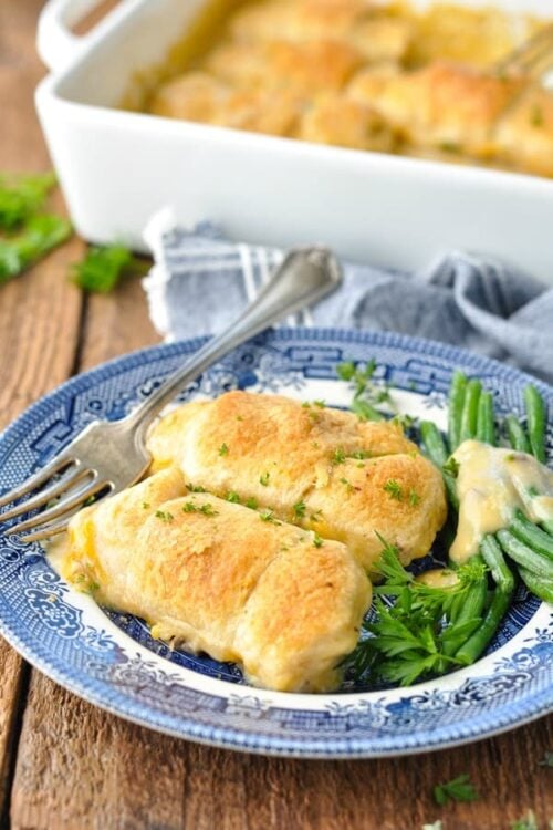 Front shot of chicken crescent rolls on a blue and white plate